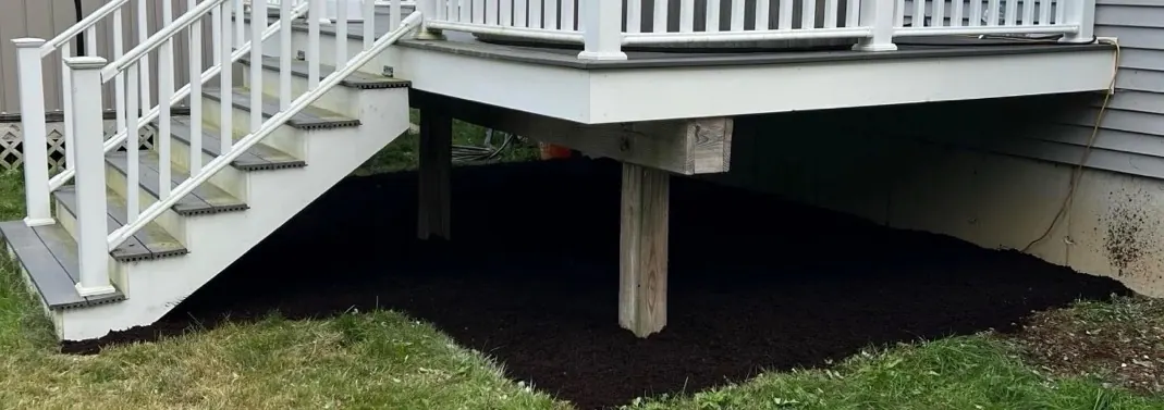 After cleanup - tidy area under deck with fresh mulch